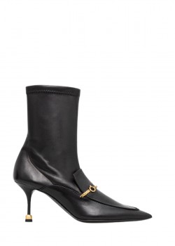 Black ankle boots with a gold chain